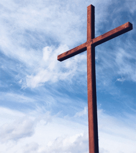 wooden cross and blue skies